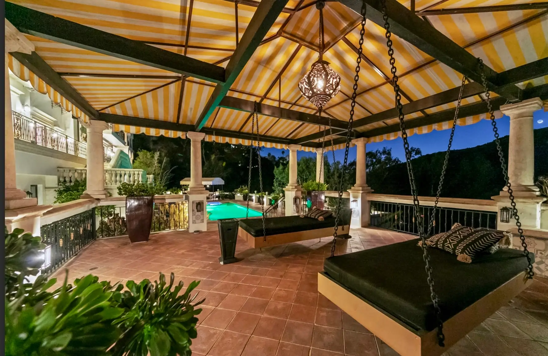 Luxury Outdoor Lounge at Legacy Healing Center – Five Stars Recovery Experience A serene outdoor courtyard features comfortable seating surrounded by lush palm trees and vibrant tropical landscaping, creating a peaceful environment ideal for clients on their recovery journey at a five stars recovery center. This tranquil space serves as a supportive setting for individual counseling and group discussions, fostering hope and connection among those seeking long-term recovery.