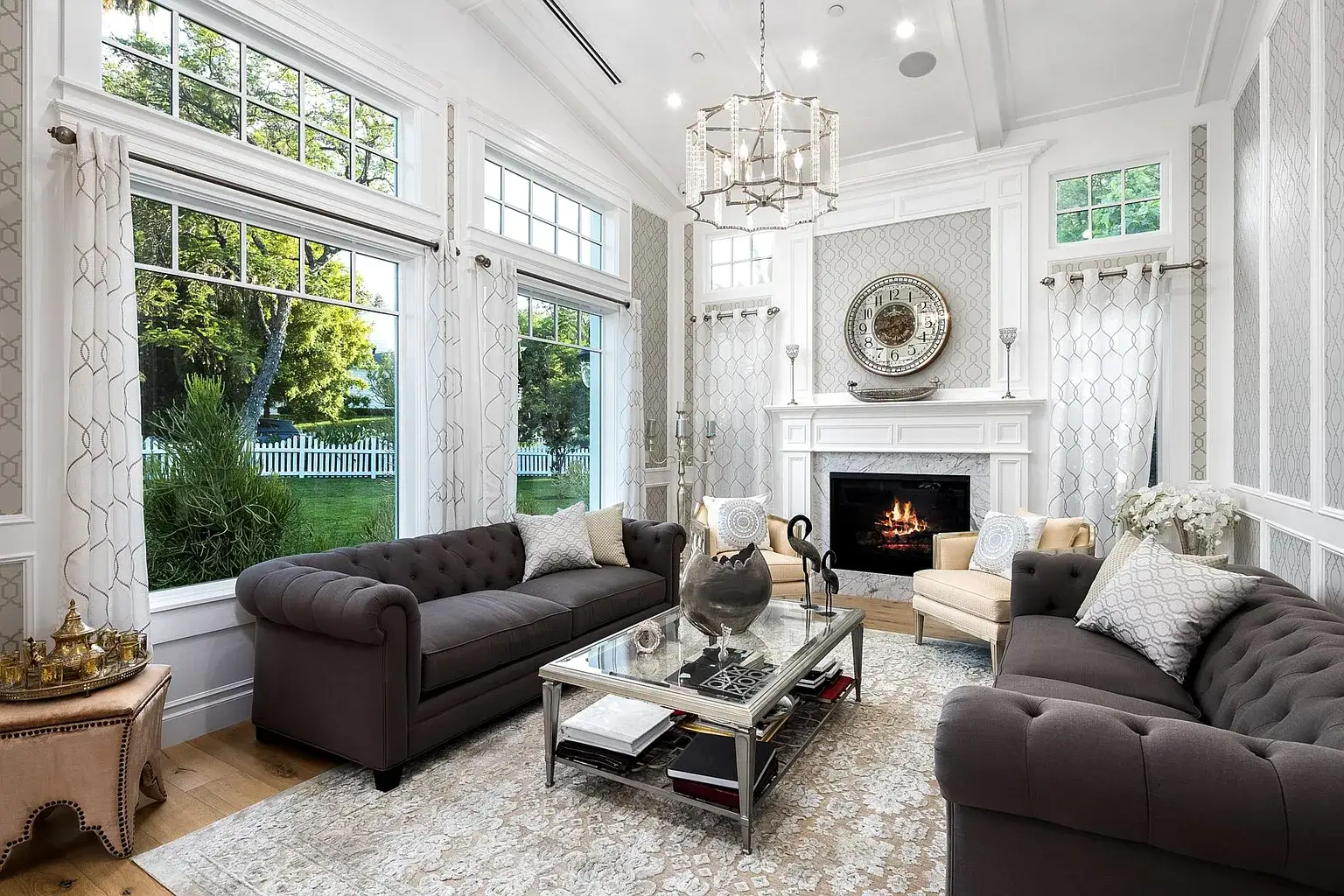The image depicts a tranquil indoor space at a luxury treatment center for codependency, featuring comfortable seating areas surrounded by modern decor and tapestries. This serene environment promotes emotional well-being and personal growth, ideal for individuals seeking recovery from codependency and other mental health conditions.